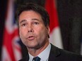 Ontario Health Minister Eric Hoskins speaks during a news conference after the first day of a meeting of provincial and territorial health ministers in Vancouver, B.C., on January 20, 2016. Hoskins has announced he is resigning from his post.