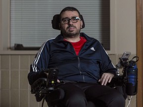 Aymen Derbali poses for a photo in Quebec City on Wednesday, December 27, 2017.  He received the $400,000 that was raised to buy him a wheelchair-accessible home in a ceremony at the mosque on Saturdy and thanked Canadians for the support they've shown him in the recent months.