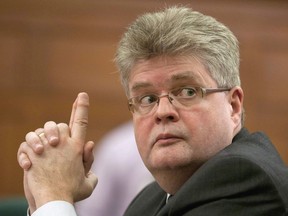 Interim public sector integrity commissioner Mario Dion waits to appear before the Commons estimates committee on Parliament Hill in Ottawa, Tuesday December 13, 2011. Pro-transparency groups are panning the new federal ethics watchdog's suggestion he should be able to prevent the media from reporting on his probes. In testimony this week, conflict of interest and ethics commissioner Mario Dion said that for many Canadians an allegation against a public office holder is akin to a finding of wrongdoing.THE CANADIAN PRESS/Adrian Wyld