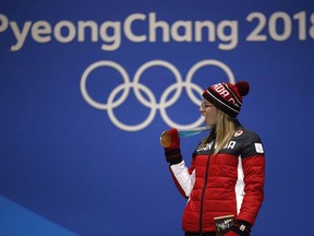 Gold medallist in the women's halfpipe Cassie Sharpe, of Canada, celebrates during the medals ceremony at the 2018 Winter Olympics in Pyeongchang, South Korea, Tuesday, Feb. 20, 2018. Calgary's mayor says hard evidence - and not warm, fuzzy emotions over Canada's strong showing at the Pyeongchang Olympics - should drive discussions over a potential 2026 Winter Games bid.THE CANADIAN PRESS/AP/Charlie Riedel