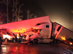 First responders and highways crews, shown late Sunday, worked through the night to help 165 victims involved in a multi-vehicle pileup on an icy stretch of the Coquihalla Highway in B.C.