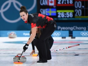 Canadian second Joanne Courtney sweeps against Sweden at the Pyeongchang Olympics on Feb. 15.