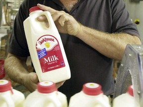 A file photo of a bottle of milk is displayed at Oakhurst Dairy in Portland, Maine.