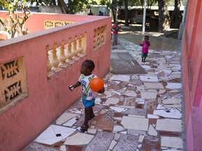Children play at the Foyer Notre Dame de la Nativite orphanage on the outskirts of Port-au-Prince, Haiti, Friday Feb. 2, 2018. The State Department is being urged by a group of U.S. senators to pressure the Haitian government into closing the orphanage where several children being adopted by U.S. families have been victims of alleged sexual abuse.