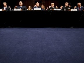 From left, FBI Director Christopher Wray, CIA Director Mike Pompeo, Director of National Intelligence Dan Coats, Defense Intelligence Agency Director Robert Ashley, National Security Agency Director Adm. Michael Rogers, and National Geospatial-Intelligence Agency Director Robert Cardillo, appear before a Senate Select Committee on Intelligence hearing on worldwide threats, Tuesday, Feb. 13, 2018, in Washington.