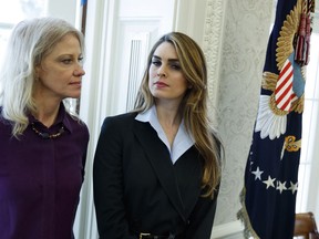 White House Communications Director Hope Hicks, right, stands with White House senior adviser Kellyanne Conway during a meeting in the Oval Office between President Donald Trump and Shane Bouvet, Friday, Feb. 9, 2018, in Washington.