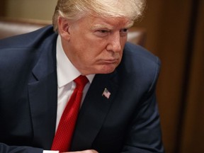 President Donald Trump listens during a meeting with law enforcement officials on the MS-13 street gang and border security, in the Cabinet Room of the White House, Tuesday, Feb. 6, 2018, in Washington.