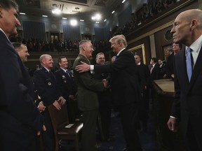 President Donald Trump greets Chairman of the Joint Chiefs of Staff Gen. Joseph Dunford after delivering his first State of the Union address in the House chamber of the U.S. Capitol to a joint session of Congress Tuesday, Jan. 30, 2018 in Washington.