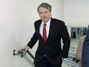 Sen. Rand Paul, R-Ky., walks to the Senate chamber, at the U.S. Capitol, Thursday, Feb. 8, 2018, in Washington.