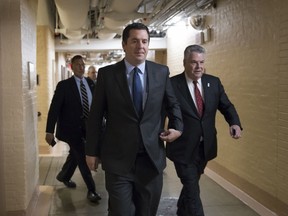 House Intelligence Committee Chairman Devin Nunes, R-Calif., strides to a GOP conference joined at right by Rep. Peter King, R-N.Y., also a member of the Intelligence Committee, at the Capitol in Washington, Tuesday, Feb. 6, 2018.