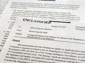 A intelligence memo is photographed in Washington, Friday, Feb. 2, 2018. After President Donald Trump declassified the memo, the Republican-led House Intelligence Committee released the memo based on classified information that alleges the FBI abused U.S. government surveillance powers in its investigation into Russian election interference.