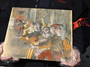 This photo taken Thursday Feb. 22, 2018 and provided by French Customs shows a stolen painting by French painter Edgar Degas. French customs have discovered an original Impressionist masterpiece by Edgar Degas stolen in 2009 _ in a suitcase on a bus.