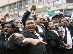 Supporters of Bangladesh Nationalist Party (BNP) shout slogans outside the court in Dhaka, Bangladesh, Thursday, Feb. 8, 2018. Bangladesh was on high alert ahead of a verdict Thursday against opposition leader and former Prime Minister Khaleda Zia in a politically sensitive corruption case.
