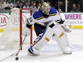 St. Louis Blues goalie Jake Allen (34) deflects a shot away from the net in the first period of an NHL hockey game against the Dallas Stars on Friday, Feb. 16, 2018, in Dallas.
