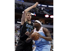 Dallas Mavericks forward Dirk Nowitzki (41) of Germany defends as Sacramento Kings forward Zach Randolph (50) works for a shot in the first half of an NBA basketball game Tuesday, Feb. 13, 2018, in Dallas.