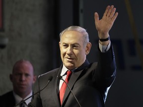 Israeli Prime Minister Benjamin Netanyahu waves during the opening ceremony for a bomb-proof emergency room in a hospital in Ashkelon, Israel, Tuesday, Feb. 20, 2018.