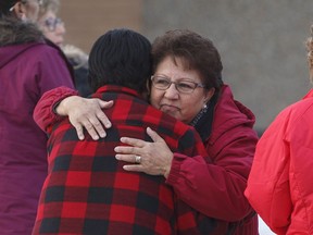 Family and supporters hug outside court as a provincial court judge decides if a teen who pleaded guilty in the 2016 shooting spree that left four people dead and seven others wounded will be sentenced as an adult in La Loche, Sask. on Friday February 23, 2018.  A young man who shot and killed four people at a school and in a home in northern Saskatchewan will be sentenced as an adult.
