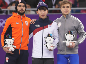 Speed skater Sjinkie Knegt denied he was giving the finger to his fellow Olympic medallists in this photo.