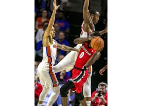 Florida guard Chris Chiozza (11) pressures Georgia guard William Jackson II (0) during the first half of an NCAA college basketball game in Gainesville, Fla., Wednesday, Feb. 14, 2018.