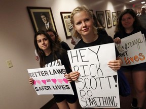 Student survivors from Marjory Stoneman Douglas High School walk through the halls of the state capitol to challenge lawmakers on gun control reform, in Tallahassee, Fla., Wednesday, Feb. 21, 2018.  The students split into several groups to talk with lawmakers and other state leaders about gun control, the legislative process, and mental health issues.