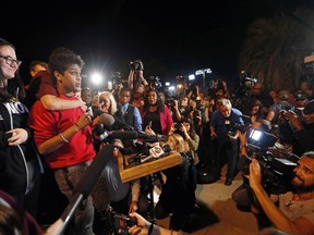Tanzil Philip, 16, a student survivor from Marjory Stoneman Douglas High School, where 17 students and faculty were killed in a mass shooting on Wednesday, speaks to a crowd of supporters and media as they arrive at Leon High School, in Tallahassee, Fla., Tuesday, Feb. 20, 2018. The students arrived in the state's capital to talk to legislators and rally for gun control reform.