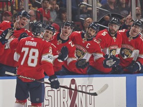 Florida Panthers right wing Maxim Mamin (78) is congratulated by teammates after scoring a goal against the Washington Capitals during the first period of an NHL hockey game, Thursday, Feb. 22, 2018, in Sunrise, Fla. The goal was Mamin's first NHL goal.