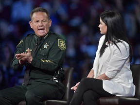 Broward Sheriff Scott Israel makes a point to NRA Spokesperson Dana Loesch during a CNN town hall meeting, Wednesday, Feb. 21, 2018, at the BB&T Center, in Sunrise, Fla.