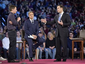 Marjory Stoneman Douglas High School student Cameron Kasky asks a question to Sen. Marco Rubio during a CNN town hall meeting at the BB&T Center in Sunrise, Fla., Wednesday, Feb. 21, 2018. Rubio was put on the defensive Wednesday by angry students, teachers and parents who are demanding stronger gun-control measures after the shooting rampage that claimed 17 lives at a Florida high school.