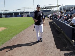 New York Yankees manager Aaron Boone walks on the field at baseball spring training camp, Wednesday, Feb. 14, 2018, in Tampa, Fla.