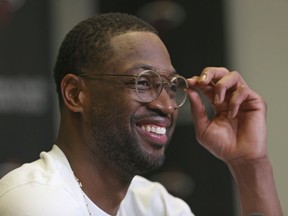 Miami Heat guard Dwyane Wade talks with the media after NBA basketball practice at the AmericanAirlines Arena in Miami, Friday, Feb. 9, 2018. Wade was traded back to the Heat from the Cleveland Cavaliers on Thursday.