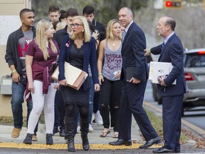 Florida Sen. Lauren Book, center, leads student survivors from Marjory Stoneman Douglas High School as they march to the Florida Capitol in Tallahassee, Fla., Wednesday, Feb 21, 2018. The students are in town to lobby the Florida Legislature to push a ban on the assault-style rifle used to kill over a dozen people a week ago.