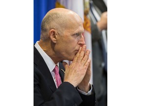 Florida Gov. Rick Scott listens during a statewide roundtable on school safety at the Florida Capital in Tallahassee, Fla., Feb 20, 2018.