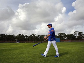 New York Mets manager Mickey Callaway walks on the field during spring training baseball practice Tuesday, Feb. 13, 2018, in Port St. Lucie, Fla.