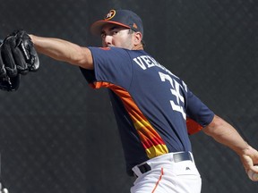 Houston Astros pitcher Justin Verlander throws a bullpen session during spring training baseball practice Thursday, Feb. 15, 2018, in West Palm Beach, Fla.