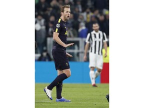 Tottenham's Harry Kane celebrates after scoring his side's opening goal during the Champions League, round of 16, first-leg soccer match between Juventus and Tottenham Hotspurs, at the Allianz Stadium in Turin, Italy, Tuesday, Feb. 13, 2018.