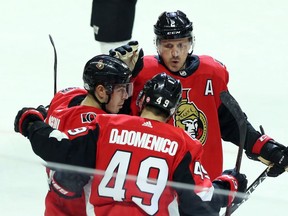 Ottawa Senators Christopher DiDomenico (49) celebrates his goal with teammates Jean-Gabriel Pageau (44) and Dion Phaneuf (2) during first period NHL action against the New Jersey Devils in Ottawa, Tuesday, February 6, 2018. The Senators have reportedly traded defenceman Phaneuf and forward Nate Thompson to the Los Angeles Kings.THE CANADIAN PRESS/Fred Chartrand