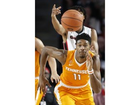 Tennessee forward Kyle Alexander (11) runs after a loose ball during an NCAA college basketball game, Saturday, Feb. 17, 2018 in Athens, Ga.