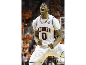 Auburn forward Horace Spencer reacts to a three point basket and strong start with a string of unanswered points against Alabama during the first half of an NCAA college basketball game Wednesday, Feb. 21, 2018, in Auburn, Ala.