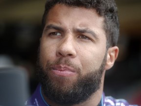 NASCAR driver Darrell Wallace Jr. speaks with a reporter before making a practice run for Sunday's NASCAR auto race Friday, Feb. 23, 2018, at Atlanta Motor Speedway in Hampton, Ga.