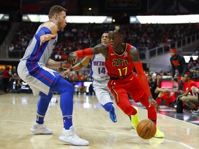 Atlanta Hawks guard Dennis Schroder (17) drives to the basket as Detroit Pistons forward Blake Griffin (23) defends in the first half of an NBA basketball game on Sunday, Feb. 11, 2018, in Atlanta.