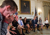 Samuel Zeif, left, a student at Marjory Stoneman Douglas High School, weeps after telling his story of the shooting at his school as other students, teachers and President Donald Trump listen.