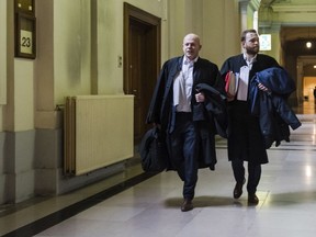 Belgian lawyer Sven Mary, left, arrives for the trial of Salah Abdeslam at the Brussels Justice Palace in Brussels on Monday, Feb. 5, 2018. Salah Abdeslam and Soufiane Ayari face trial for taking part in a shooting incident in Vorst, Belgium on March 15, 2016. The incident took place when six members of a Franco-Belgian research team investigating the attacks in Paris were conducting a search in an allegedly empty safe house of the terrorists and were attacked.