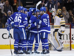 The Maple Leafs celebrate a goal by Mitch Marner, centre, during first period NHL action against the Boston Bruins at the Air Canada Centre in Toronto on Saturday night.