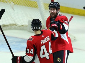 Zack Smith celebrates his goal against the New Jersey Devils with Senators teammate Jean-Gabriel Pageau during the second period of their game Tuesday night in Ottawa.
