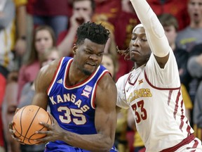 Kansas' Udoka Azubuike (35) is guarded by Iowa State's Solomon Young (33) during the first half of an NCAA college basketball game in Ames, Iowa, Tuesday, Feb. 13, 2018.