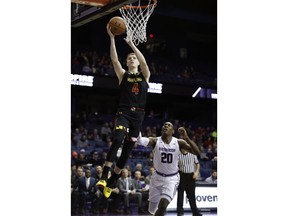Maryland guard Kevin Huerter (4) goes to the basket against Northwestern guard Scottie Lindsey (20) during the first half of an NCAA college basketball game Monday, Feb. 19, 2018, in Rosemont, Ill.