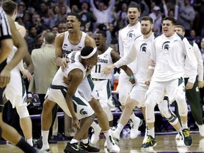 Michigan State Michigan State guard Cassius Winston, left, celebrates with guard/forward Miles Bridges after scoring a basket during the second half of an NCAA college basketball game against Northwestern, Saturday, Feb. 17, 2018, in Rosemont, Ill. Michigan State won 65-60.
