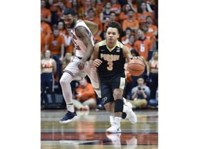 Purdue guard Carsen Edwards (3) makes a move down the court past Illinois guard Mark Alstork (24) during the first half of an NCAA college basketball game in Champaign, Ill., Thursday, Feb. 22, 2018.