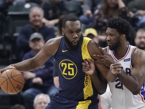 Indiana Pacers' Al Jefferson is defended by Philadelphia 76ers' Joel Embiid during the first half of an NBA basketball game, Saturday, Feb. 3, 2018, in Indianapolis.