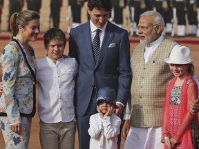 Indian Prime Minister Narendra Modi, right, poses for photographs with Justin Trudeau, Trudeau's wife Sophie Gregoire Trudeau, left, Trudeau's sons Xavier and Hadrien, daughter Ella-Grace upon their arrival at the Indian presidential palace during a ceremonial reception, in New Delhi, India, Friday, Feb. 23, 2018.